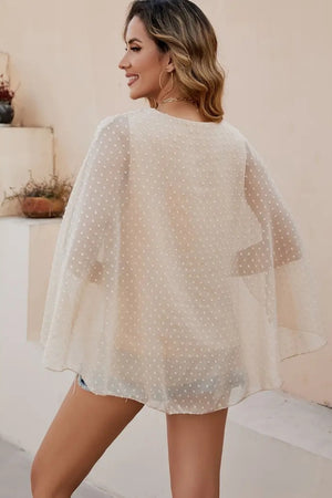 Dotted Swiss cape sleeve blouse in khaki with a sheer overlay.