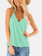 Misty blue draped crossover halter cami with V-neck and spaghetti straps.