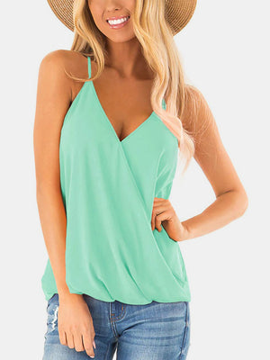 Misty blue draped crossover halter cami with V-neck and spaghetti straps.