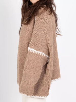 Camel oversized knit cardigan with contrast white trim detail on sleeves and hem.