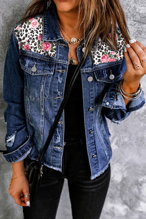 Denim trucker jacket with leopard floral patches and distressed details.