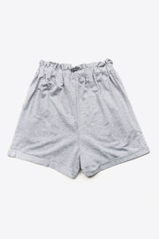 Light gray paperbag waist shorts with decorative buttons and a comfortable fit.