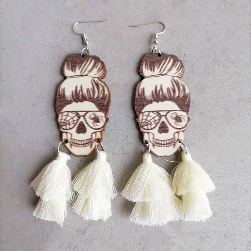 Skull bun drop earrings with white tassels and spiderweb glasses detail