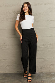 White lace-trimmed short sleeve bodysuit with an open back and tie detail.