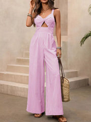 Blush pink striped jumpsuit with twist-front cutout and wide legs.