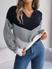 Chevron block knit polo sweater with collar and long sleeves in black, gray, and white acrylic.