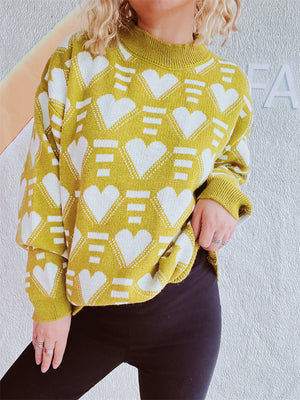 Mustard acrylic knit jumper with allover white geometric heart pattern and mock neck.