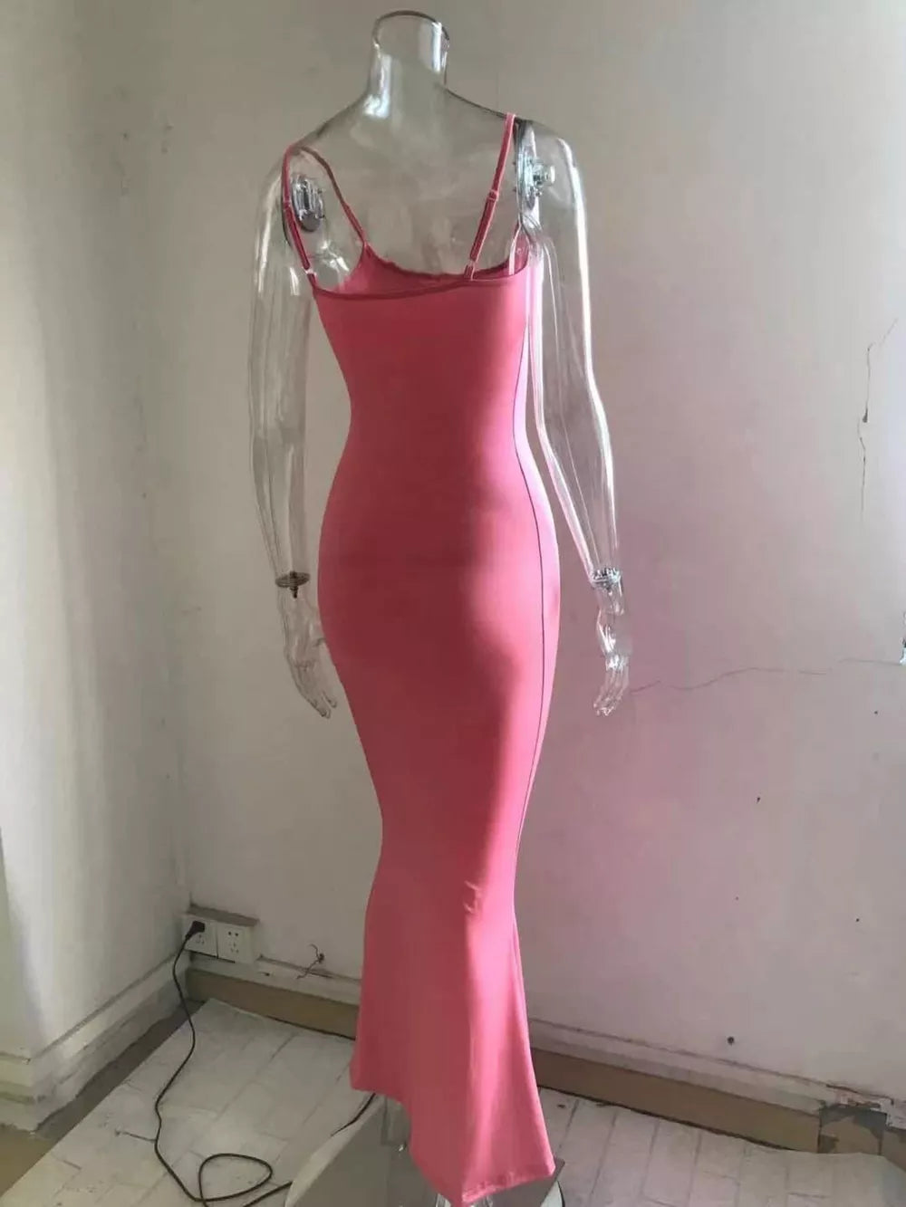 Spaghetti strap bodycon maxi dress in burnt coral with a flared hem.