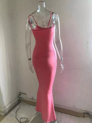 Spaghetti strap bodycon maxi dress in burnt coral with a flared hem.