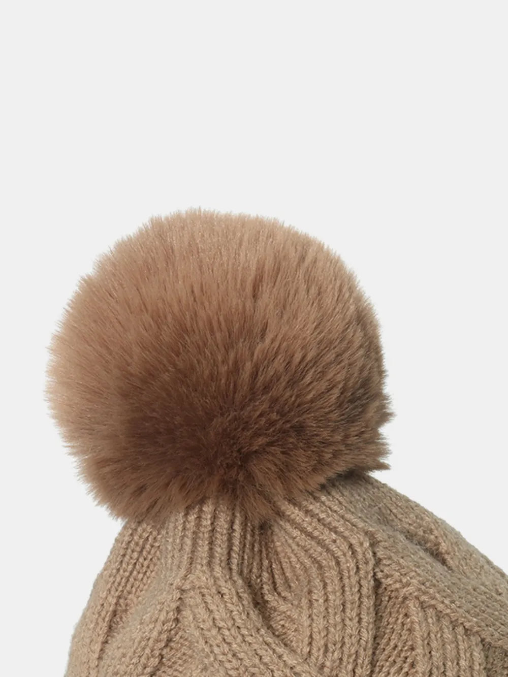 Camel cable knit beanie with a fluffy pompom detail