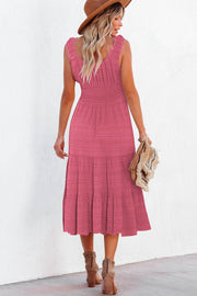Deep rose smocked midi dress with tiered skirt and ruffled straps.