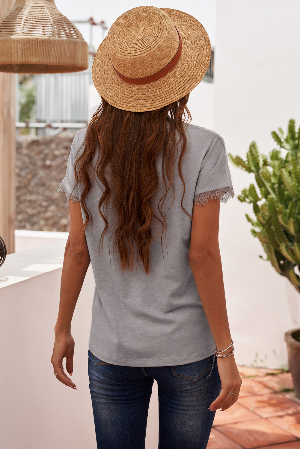 Dark gray V-neck tee with lace trim on short sleeves.