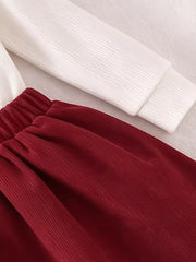 Children's Floral Applique Mock Neck Top And Pleated Skirt Set in White, model styling view