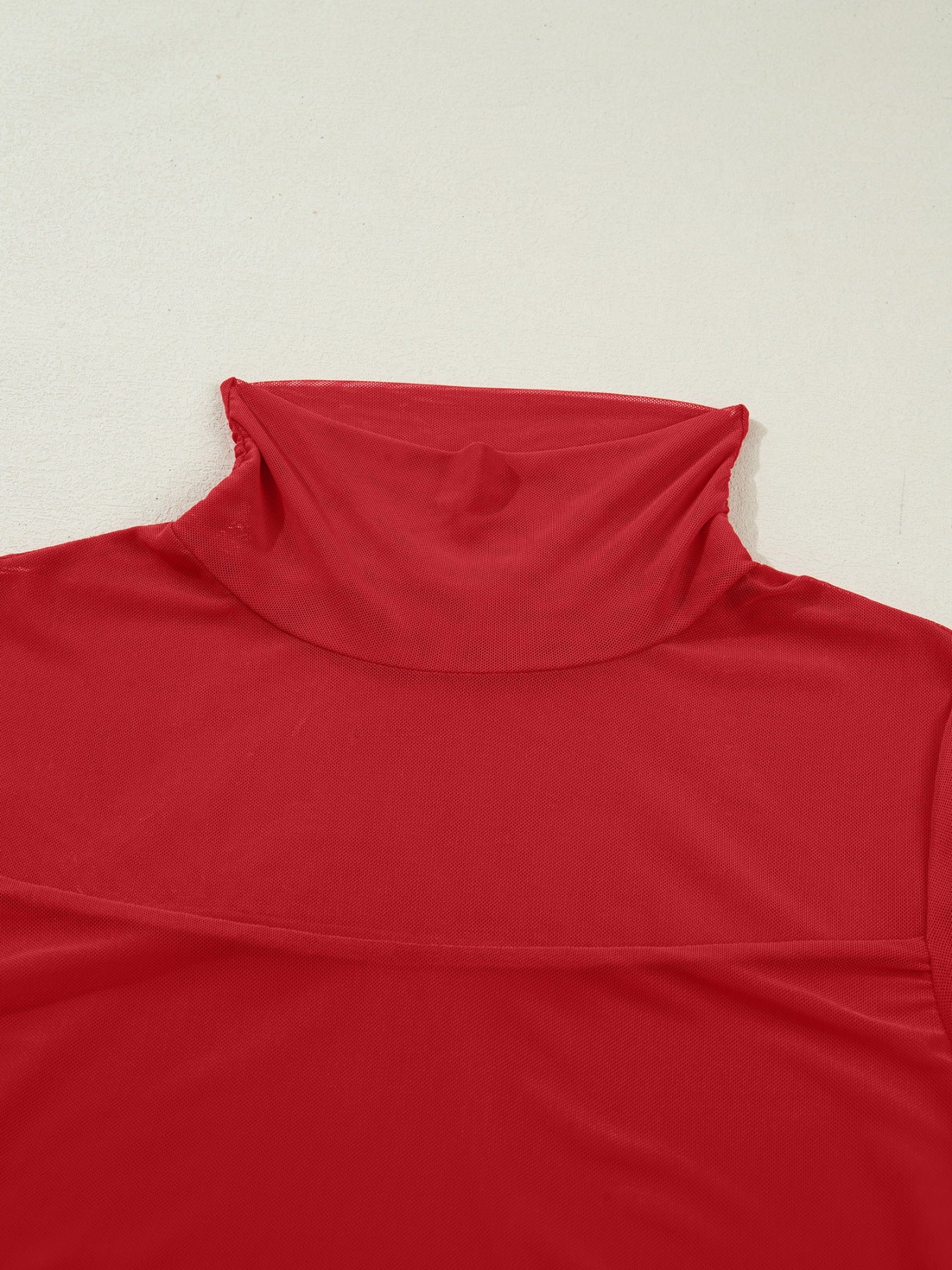 Deep red sheer mesh patchwork maternity blouse with high neck and long sleeves.