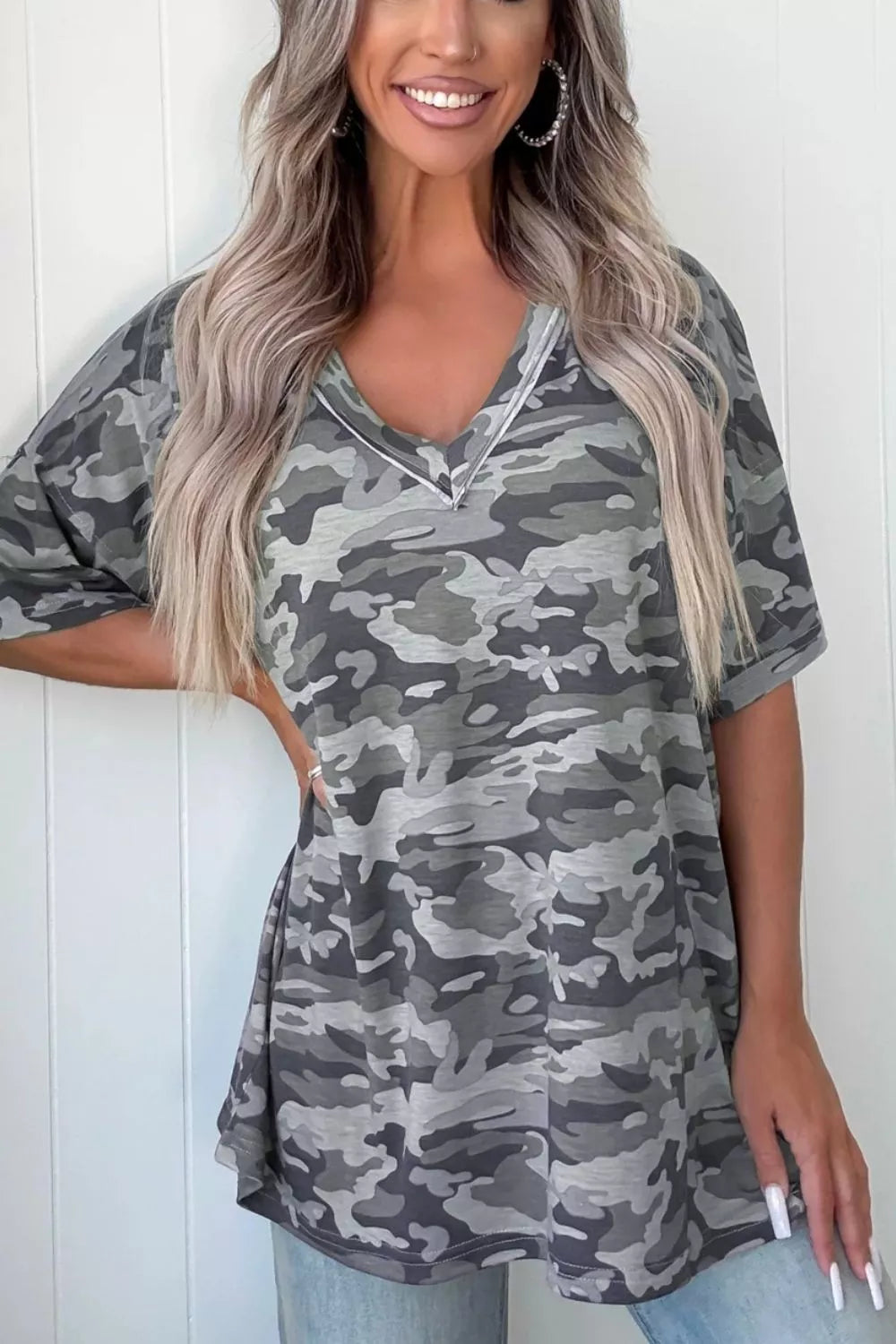 Camouflage V-neck relaxed tee with short sleeves and a white trim detail.