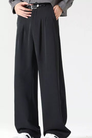Men's black wide leg dress pants with pleats and a belt.
