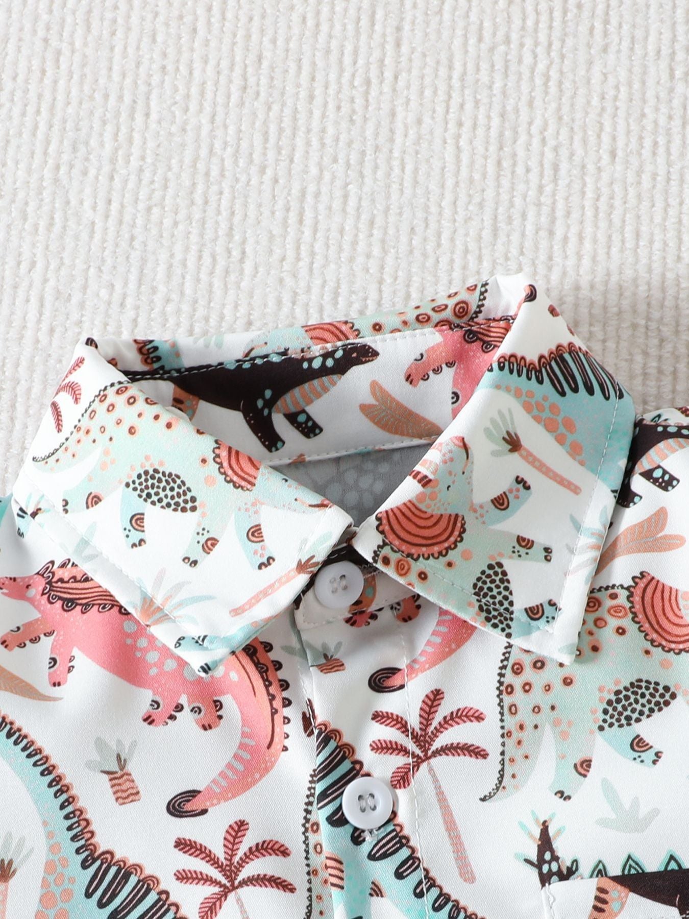 Toddler cotton shirt with dinosaur print, collared, button-down, light brown and blue.