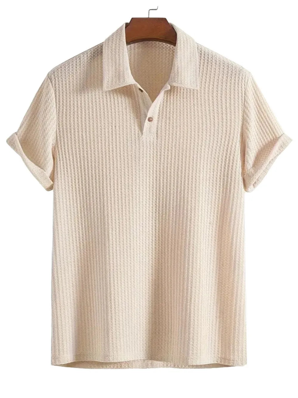 Beige textured polo shirt with a waffle knit, button placket, and cuffed rolled sleeves.