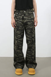Wide-leg camo denim trousers in black with a relaxed fit.