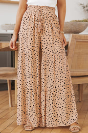 Dalmatian print palazzo trousers in watermelon pink with tiered ruffles and a drawstring waist.