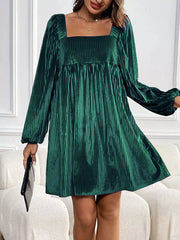 Dark green velvet mini dress with square neckline, long sleeves, and pleated texture.