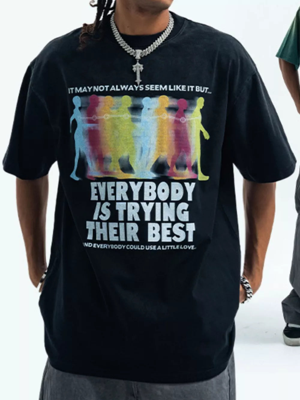 Acid wash graphic t-shirt in Wash Black with colorful figures and text print.