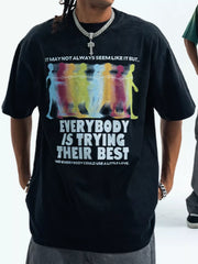 Acid wash graphic t-shirt in Wash Black with colorful figures and text print.