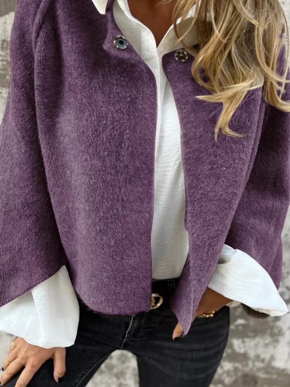 Purple fuzzy knit cardigan with button detail, open front, worn over white shirt.