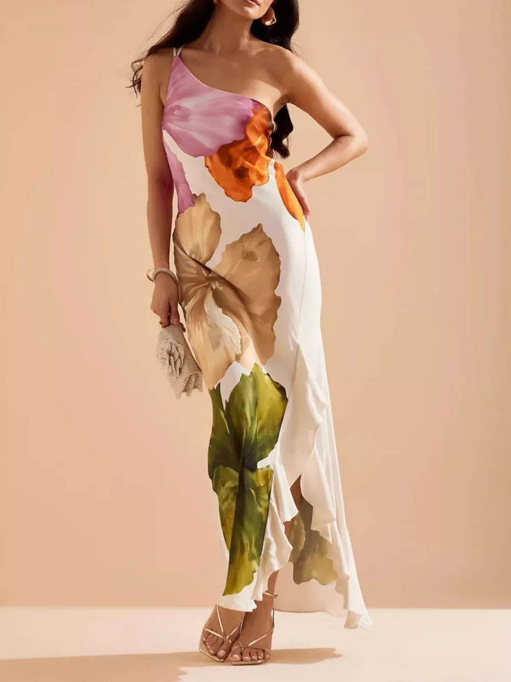 Floral one-shoulder maxi dress with cascading ruffle and large bloom print.