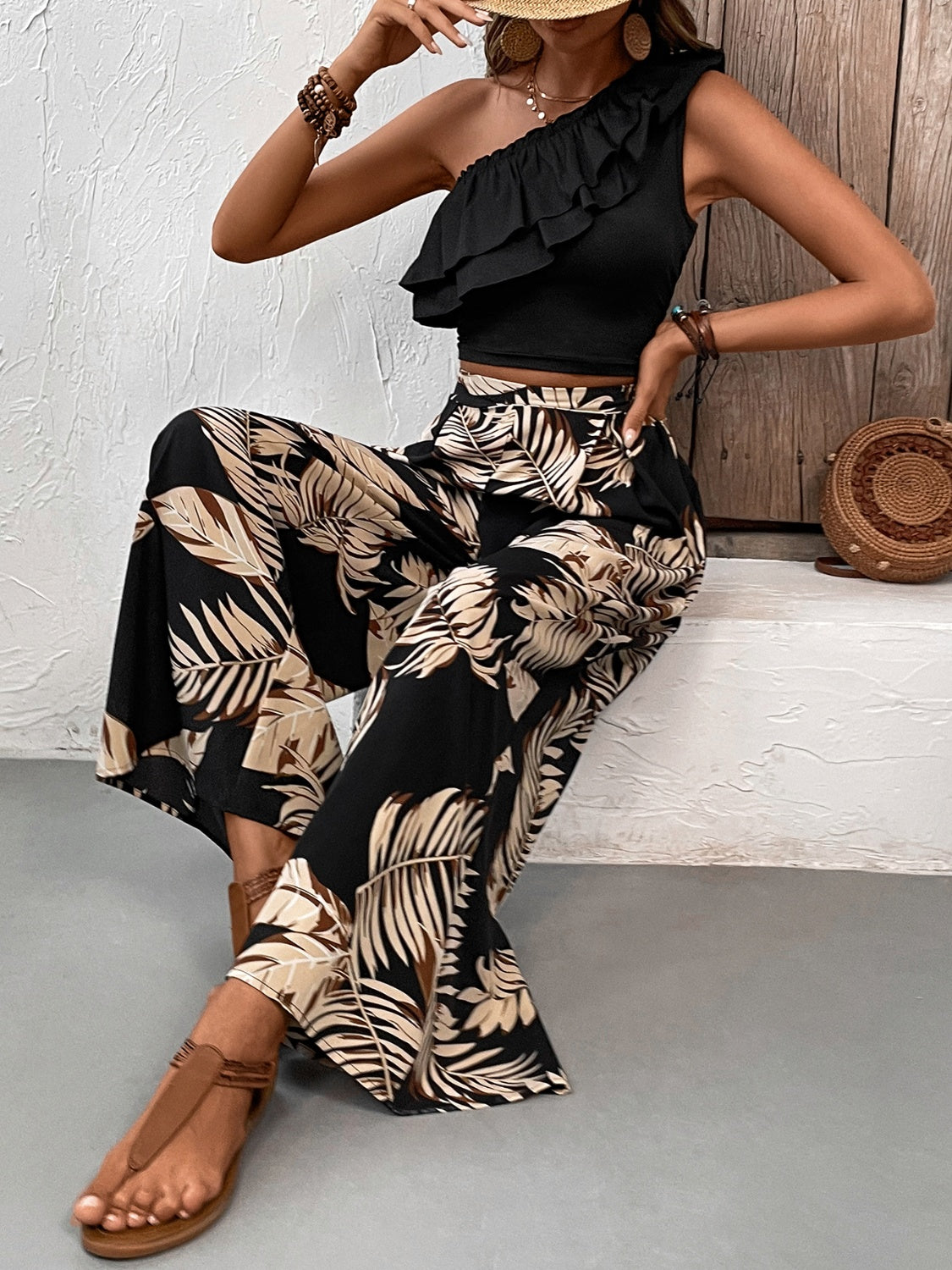 Black asymmetrical ruffle crop top and wide-leg palm print pants set