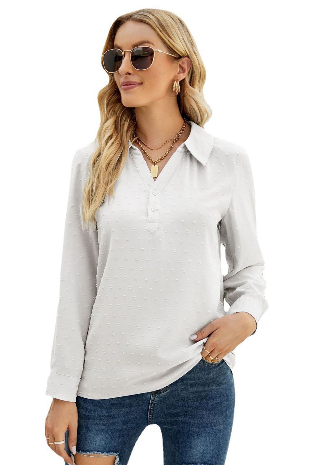 White textured collared blouse with button placket and long sleeves.