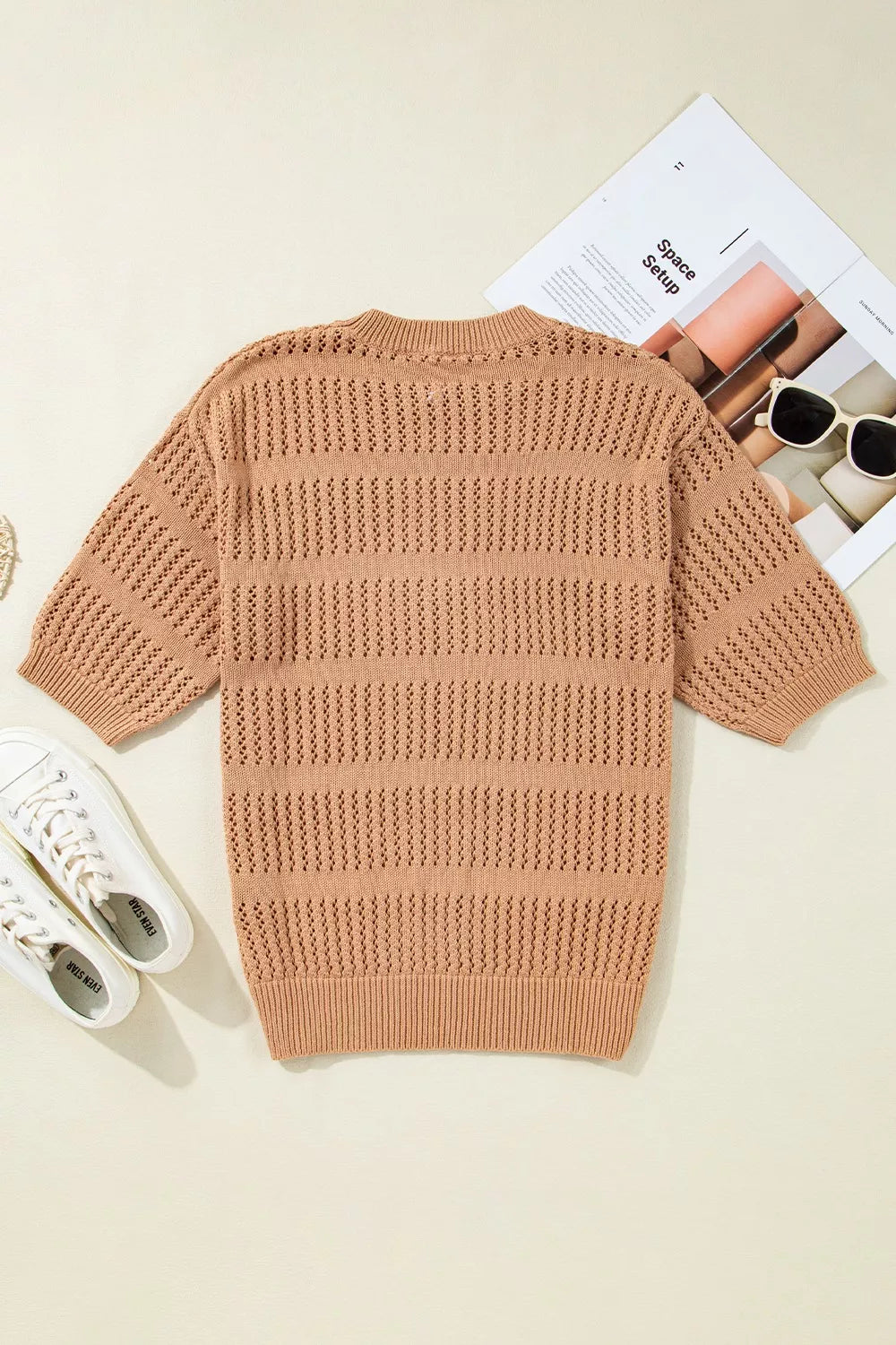 Sleek openwork knit top in tan with elbow sleeves and a crew neck.
