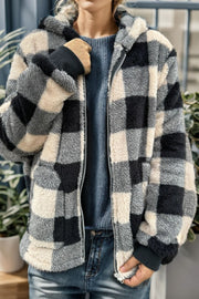 Sherpa zip-up jacket with black, cream, and gray buffalo check pattern and ribbed cuffs.