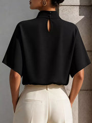 Black mock neck t-shirt with relaxed sleeves and keyhole back detail.