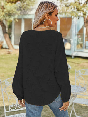 Black textured puff sleeve blouse with V-neck, casual style.