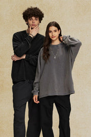 Raglan sleeve washed cotton sweatshirt in dark gray with a crew neck.