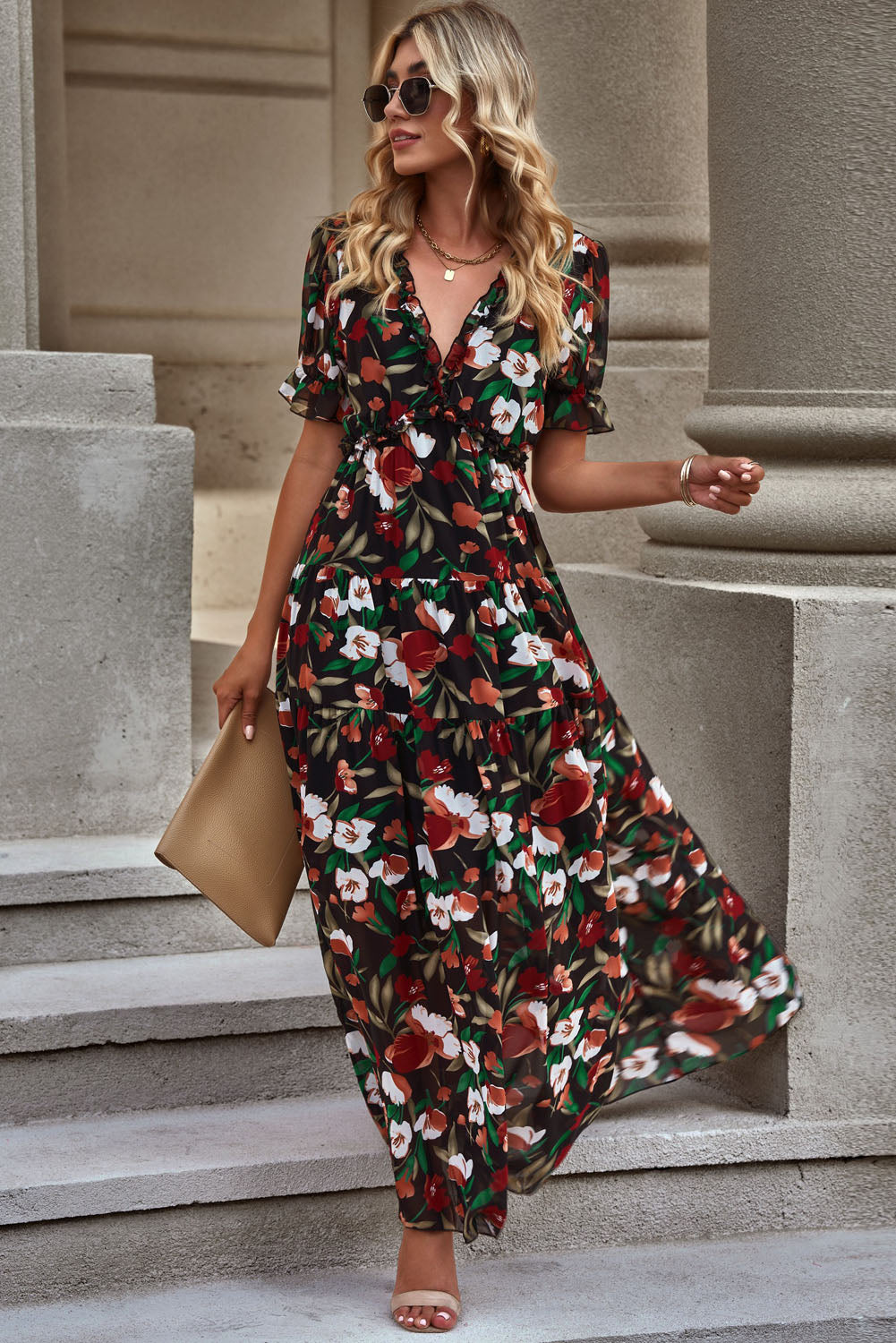 Black floral maxi dress with puff sleeves and tiered skirt