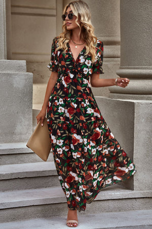Black floral maxi dress with puff sleeves and tiered skirt