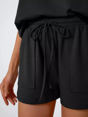 Black bikini shorts with drawstring waist and pockets