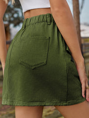 Army green utility mini skirt with elastic waist and back pocket.
