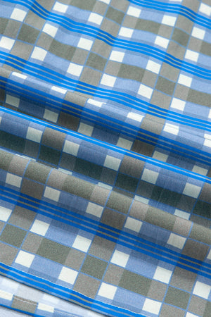 Blue plaid button-down shirt with frilled detail and striped accents