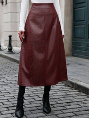 Burgundy croc-effect A-line midi skirt with a faux leather finish.