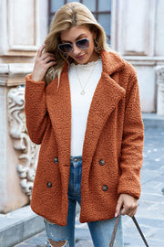 Teddy pea coat in burnt orange with double-breasted buttons and a textured fleece finish.