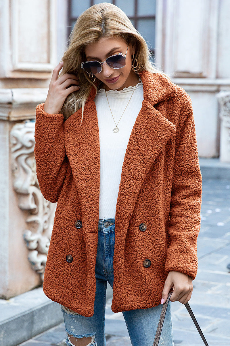 Teddy pea coat in burnt orange with double-breasted buttons and a textured fleece finish.