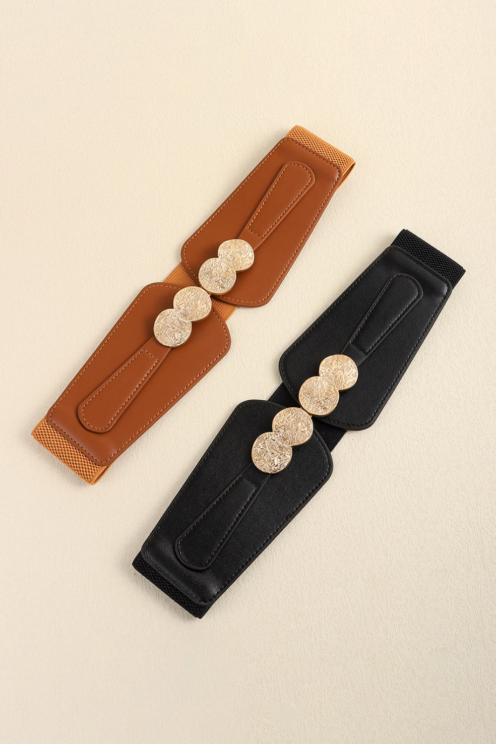 Black and caramel elastic belts with embossed alloy clasps