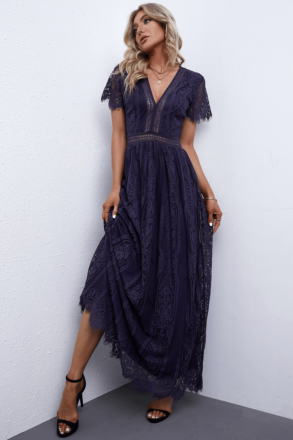 Navy lace midi dress with V-neck, flutter sleeves, and scalloped hem.
