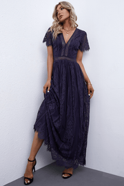 Navy lace midi dress with V-neck, flutter sleeves, and scalloped hem.
