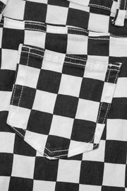 Checkerboard distressed cropped jeans in black and white denim with a back pocket detail.