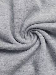 Gray boat neck sweater fabric detail, showing soft knit texture.