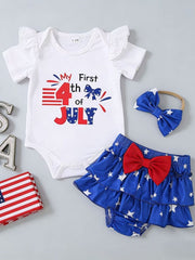 White baby bodysuit with ruffle sleeves and "My First 4th of July" graphic, blue star tiered skirt with red bow, and